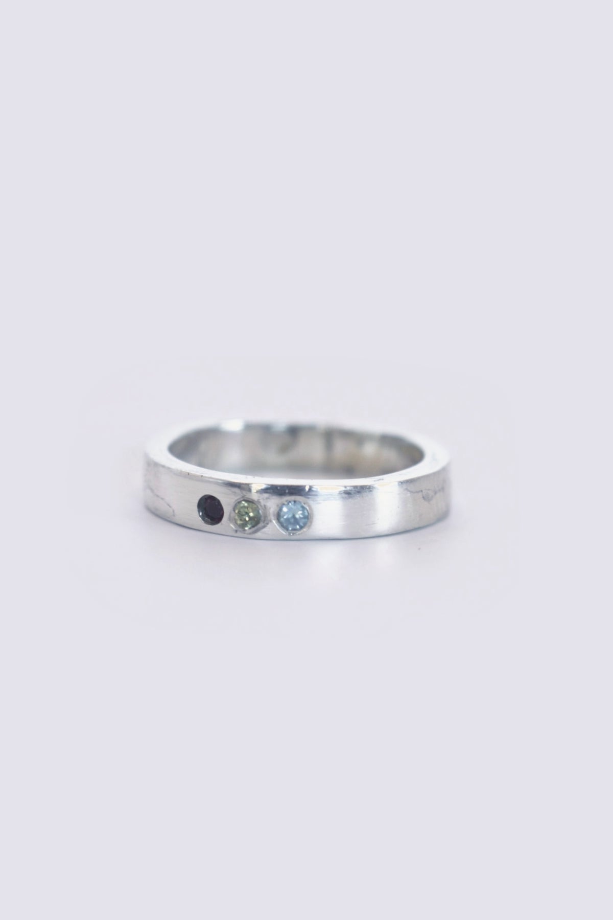 thin band w/ topaz, ruby and cz
